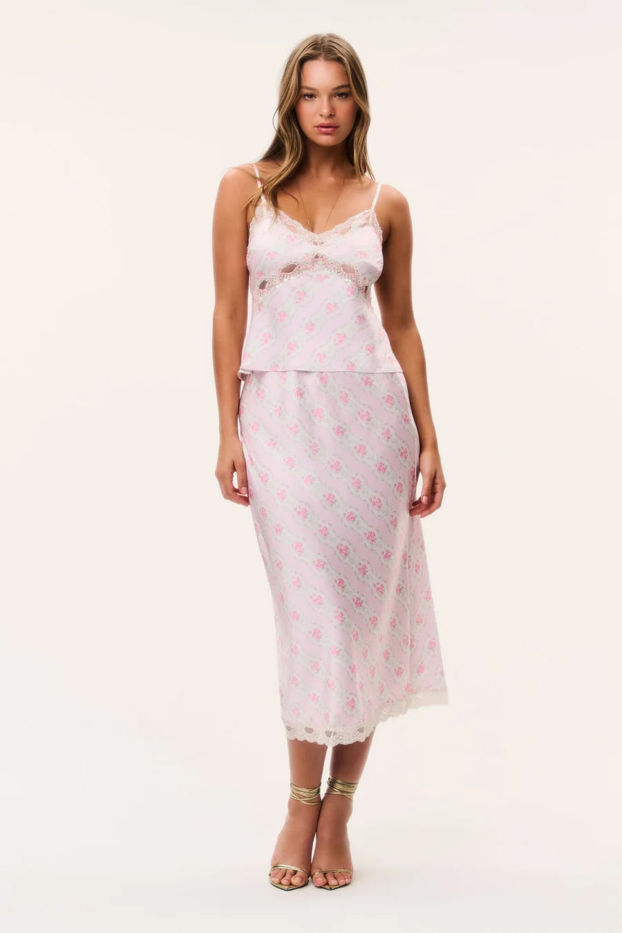 LoveShackFancy Castle Skirt in pink floral print, a bias-cut midi slip skirt with delicate scalloped lace trim at the hem.