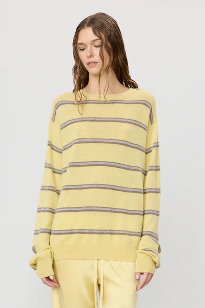 woman wearing butter yellow stiped james sweater