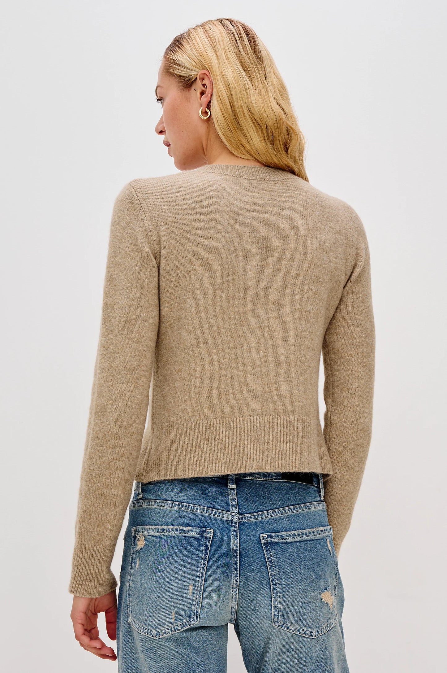 The Matilda is a cropped take on the cardigan, with a luxurious cashmere blend. It's cute enough to wear on its own or add dimension by layering.