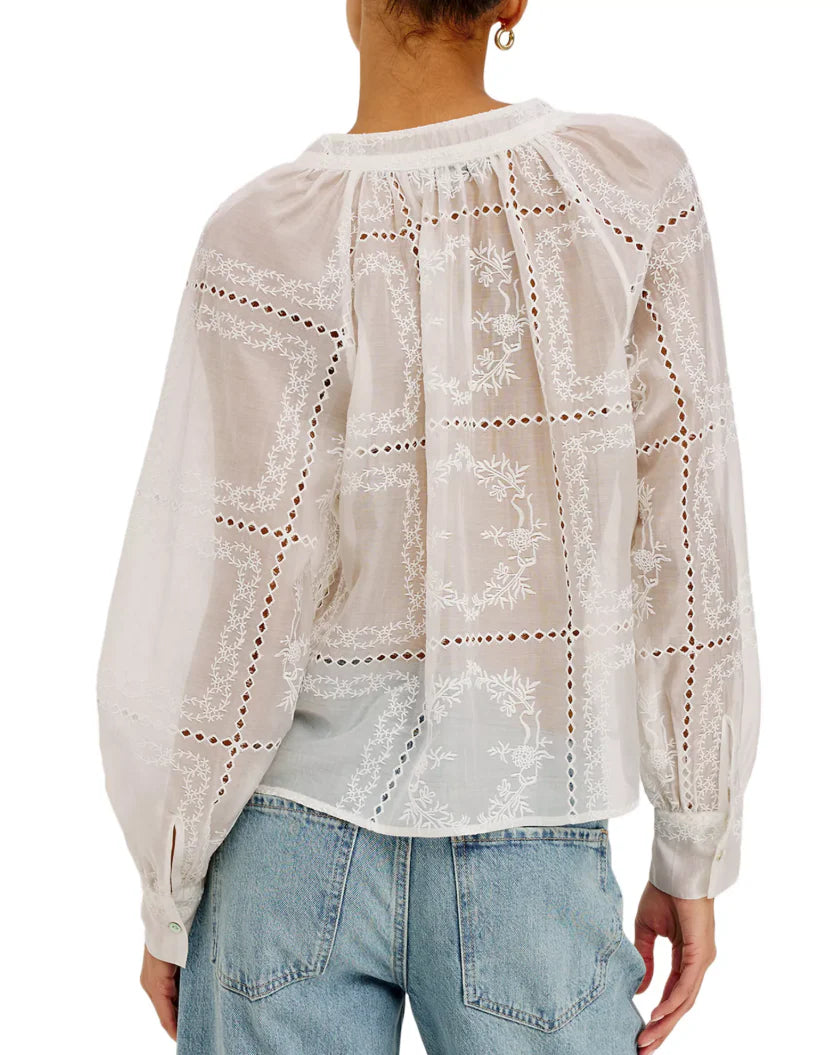 The Francine is a cropped, boxy top in broderie anglaise eyelet cotton, featuring a V-neckline with split band collar