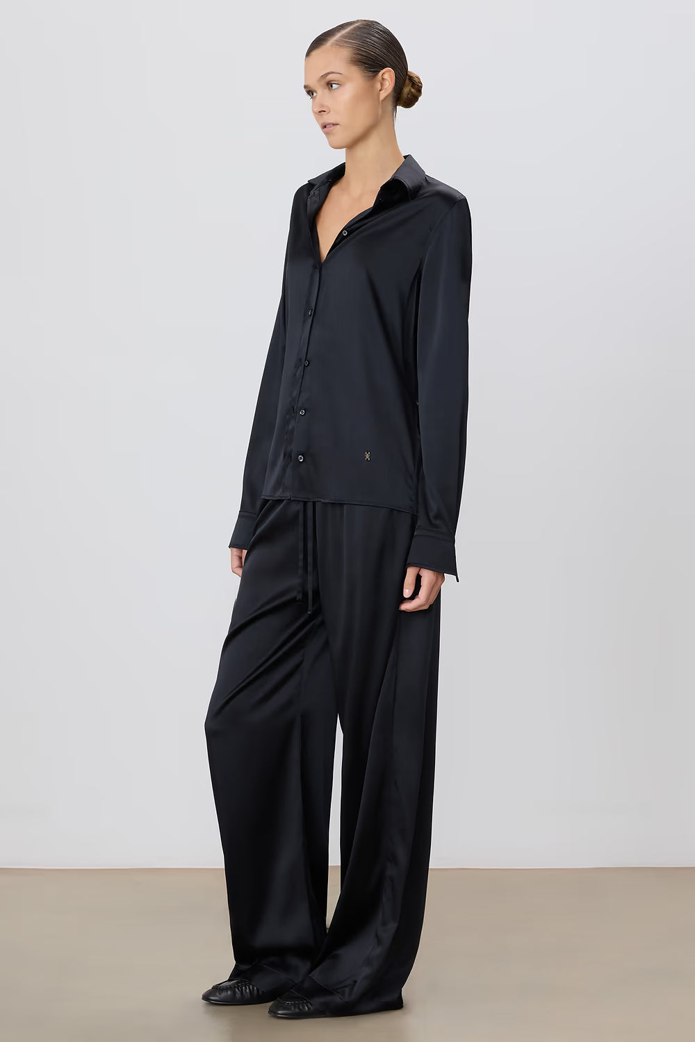 woman wearing black silk pant - eterne brand brody pant.