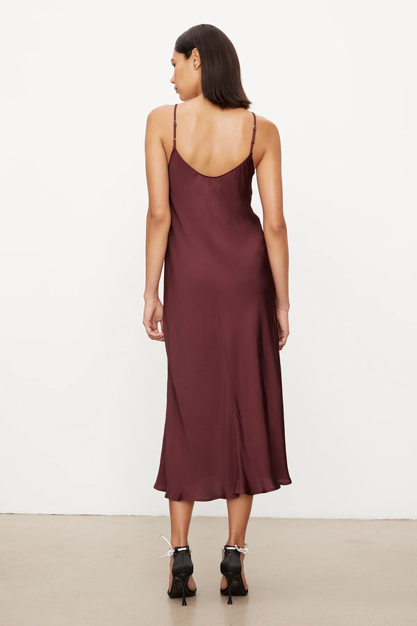 Cut on the bias, the simple slip dress is truly one of the most versatile closet staples. With adjustable straps and a flared skirt, it skims the figure and is the ultimate day-to-night essential.