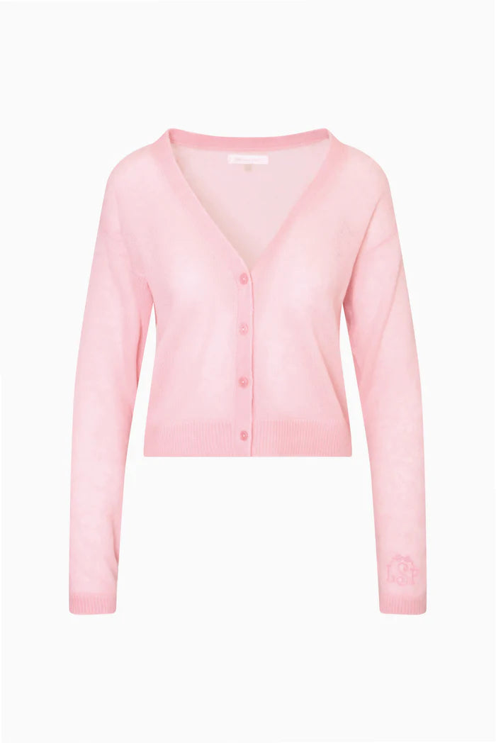 The Breckie Cardigan is a dreamy sheer knit essential. Crafted from a luxe alpaca-wool blend, this V-neck cardigan features long sleeves,