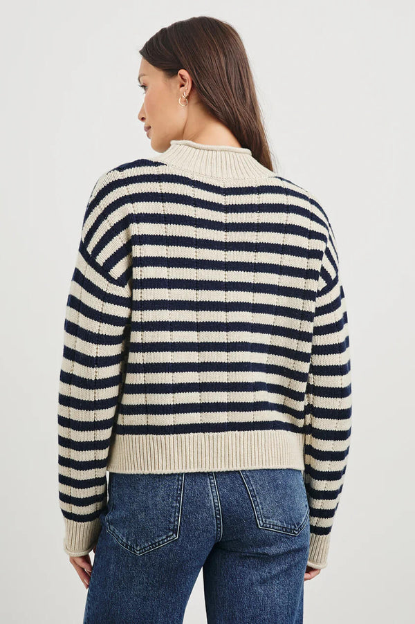 A heritage-inspired sweater crafted from ultra-soft, merino wool. With novelty drop-stitch and cast-off details at the cuffs and roll-neck