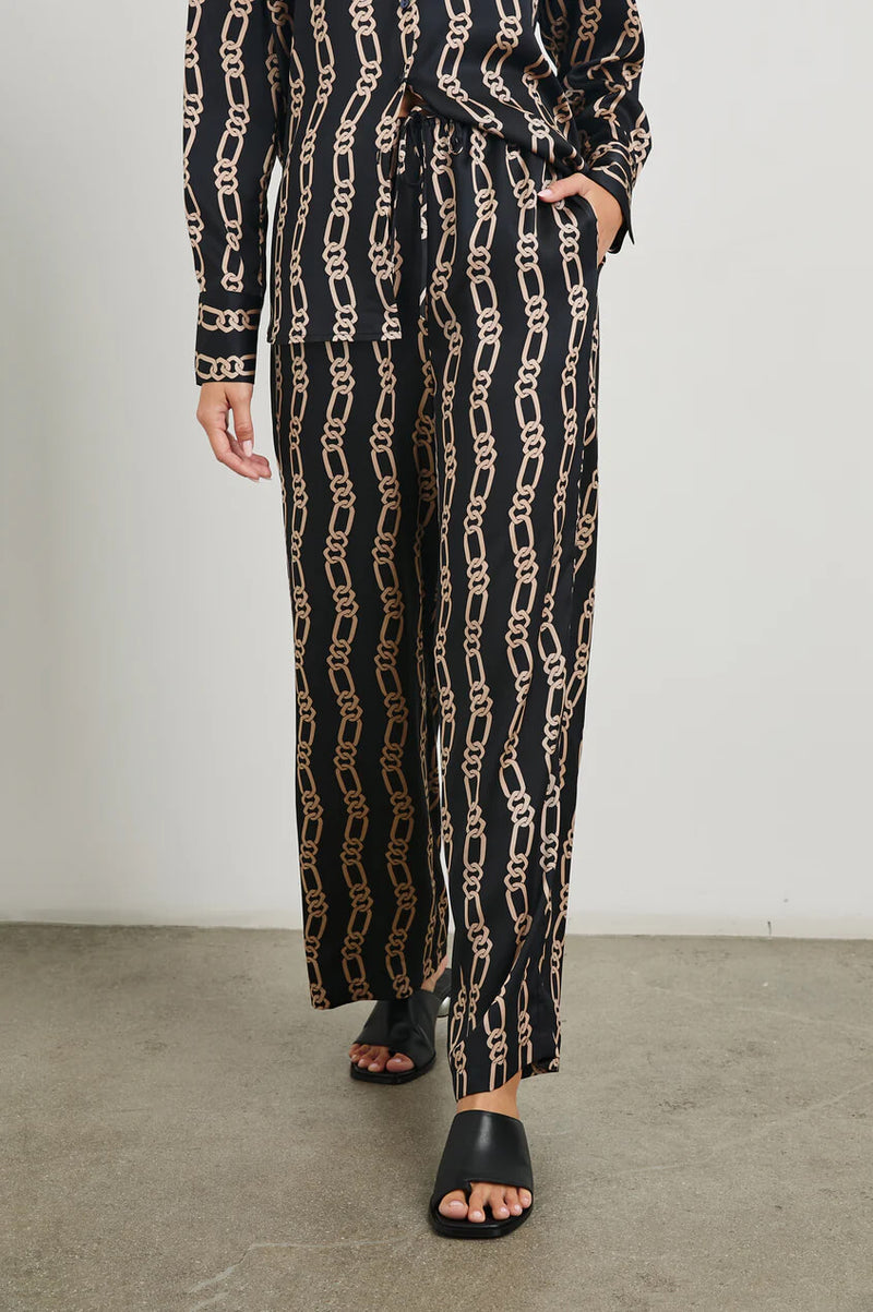 Experience elevated comfort with the Damani. This wide-legged drawstring pant features pockets and a statement-making, chain-link print. Pair with the Ledger shirt for an ultra-luxe outfit designed for everyday wear.
100% Polyester.