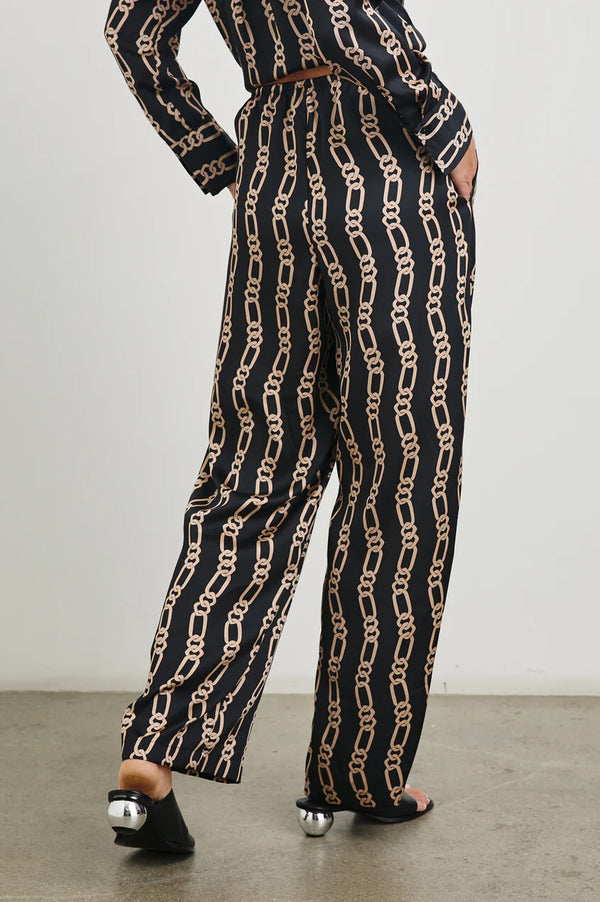 Experience elevated comfort with the Damani. This wide-legged drawstring pant features pockets and a statement-making, chain-link print. Pair with the Ledger shirt for an ultra-luxe outfit designed for everyday wear.
100% Polyester.