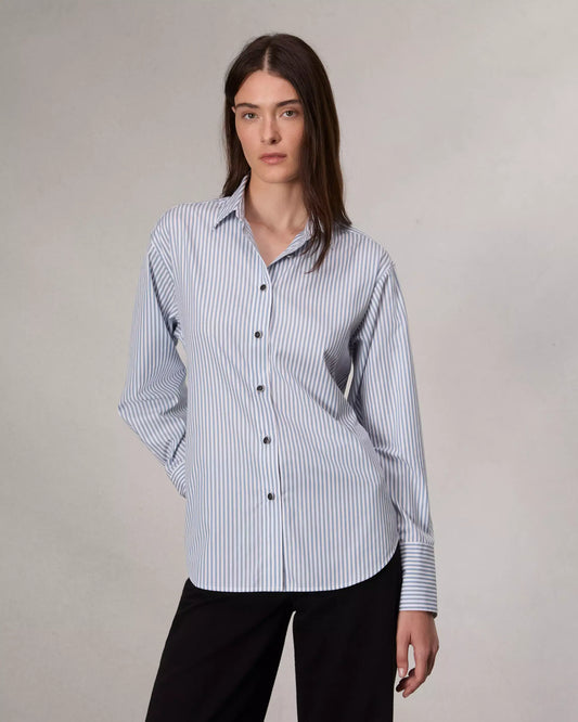 Tailored from crisp cotton poplin, this striped button-up shirt nods to classic trench coats with a storm shield-inspired panel and adjustable waist tie at the back.