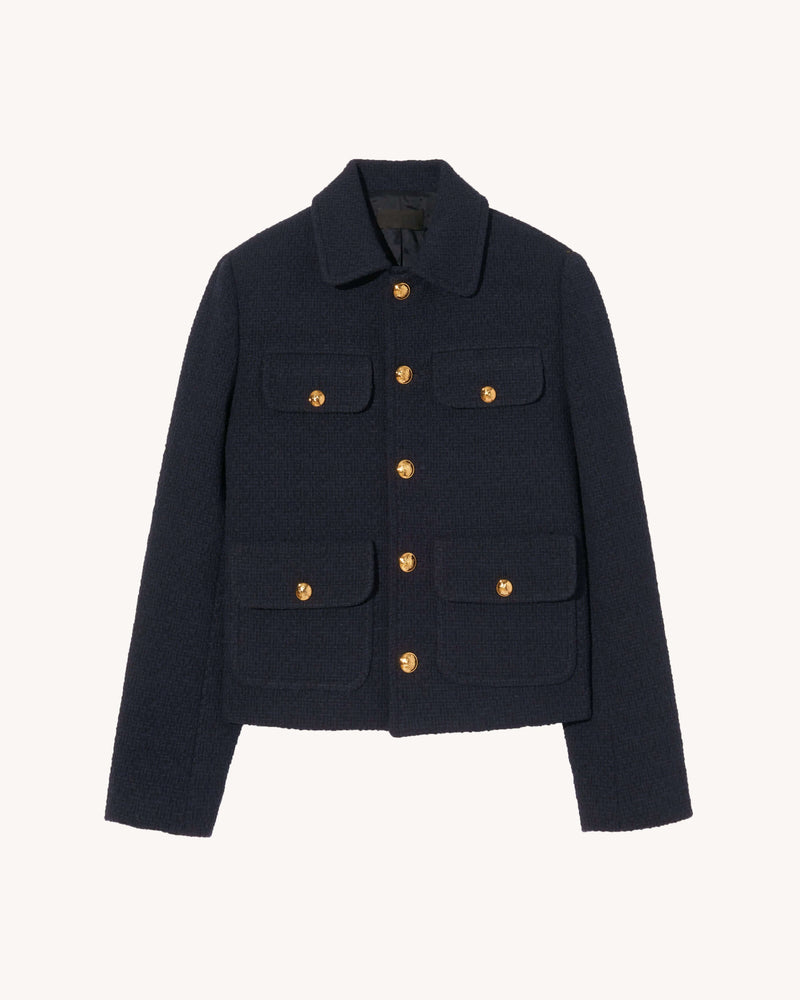 Cropped boxy jacket in Italian wool. Soft structured shoulder pads. Flap patch pockets. Signature crest buttons in gold. Fully lined.