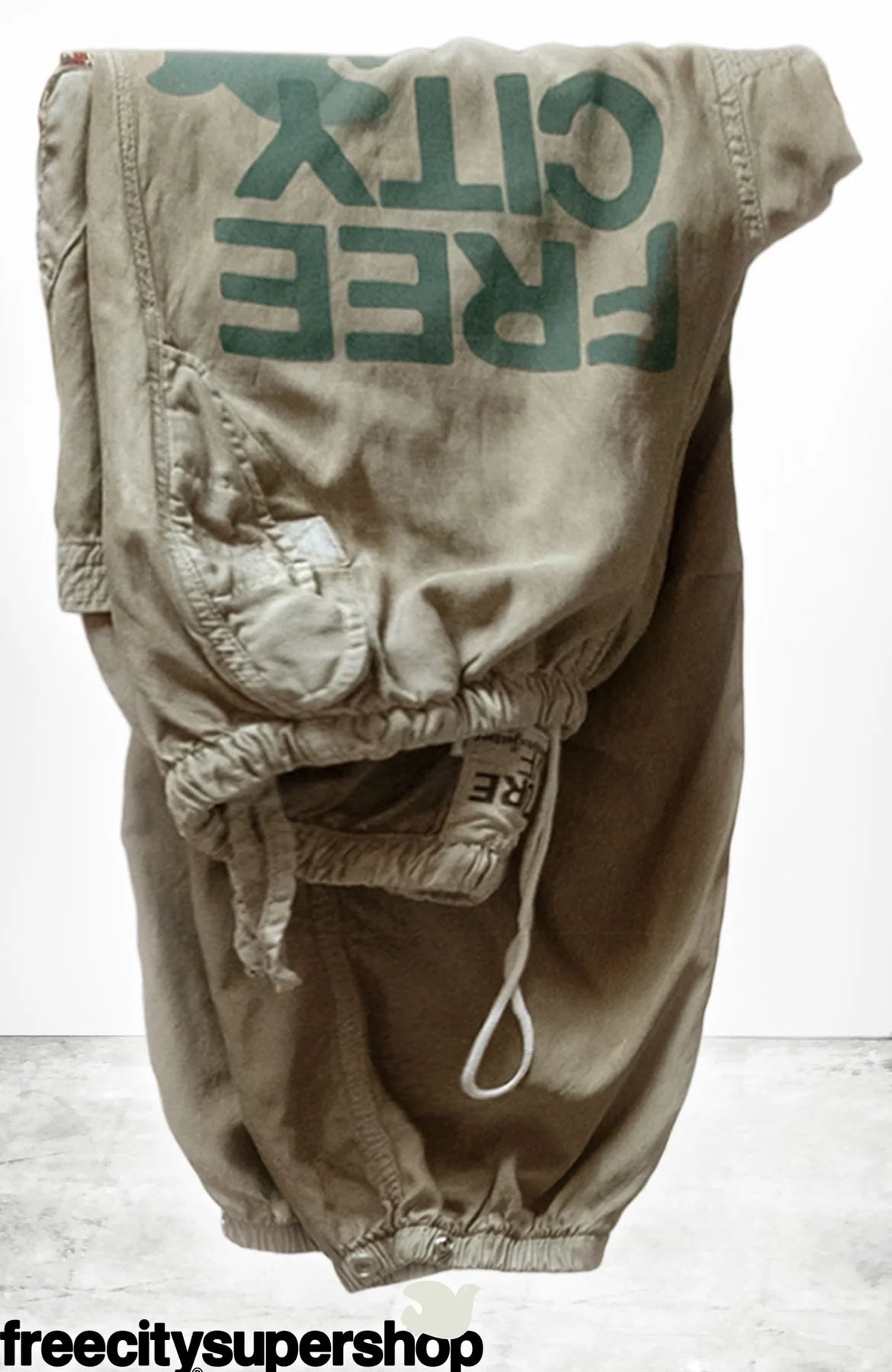 classic "FREECITY" print in surplus green with light green dove, custom flap side-pockets, 3d back pocket