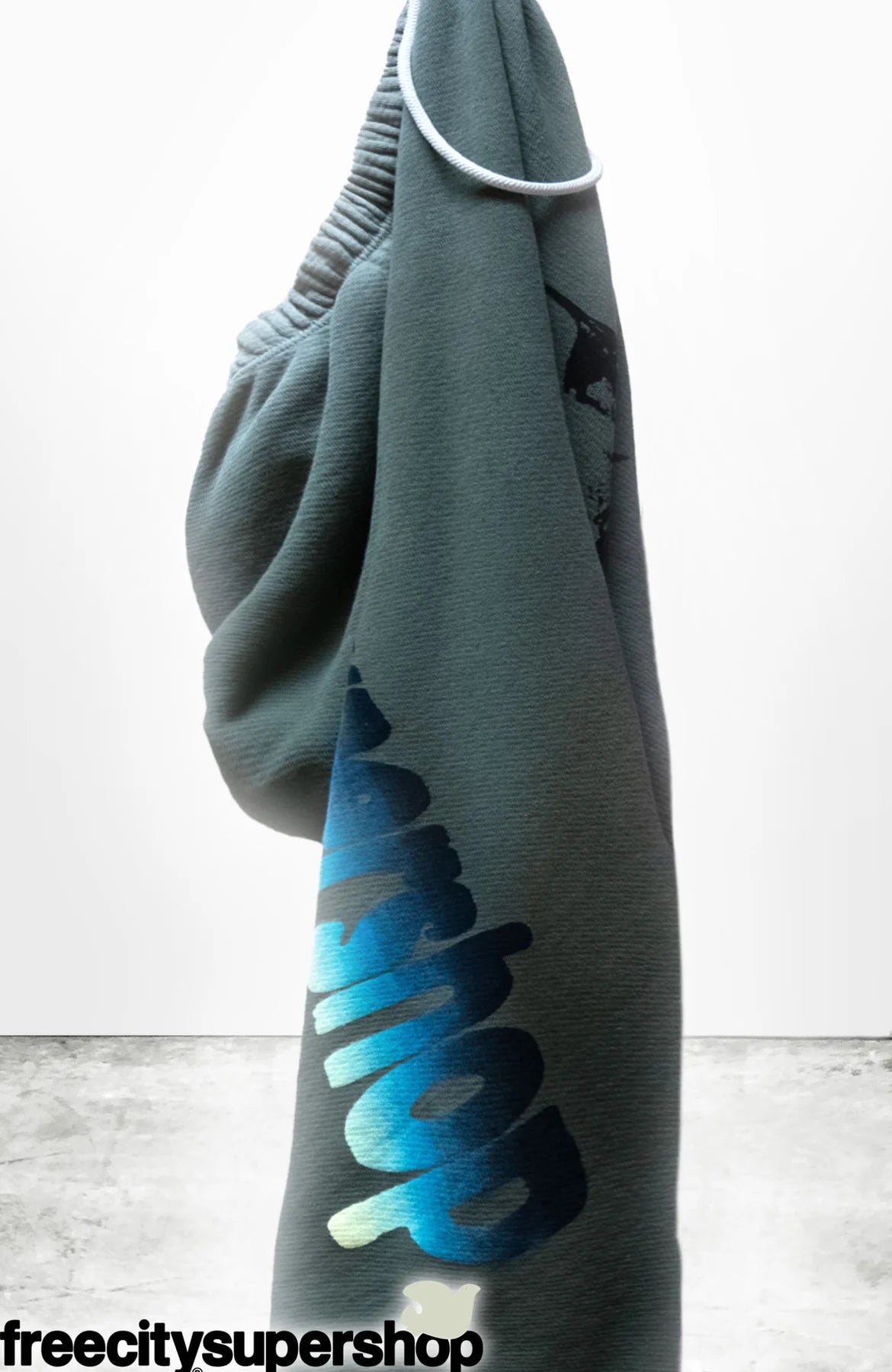 hand-screen "SPARROW" print in black and custom on-screen hand-mixed gradient "SUPERSHOP" print down right leg in blue/cream.