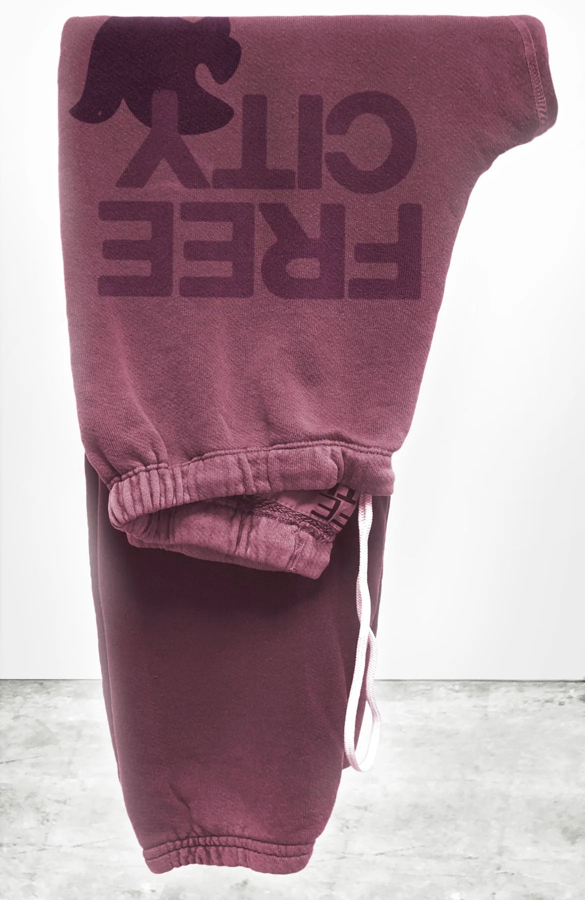 Unisex FLOW sweatpant in roses with classic "FREECITY" print in burgundy and tonal  "FREECITYDOVE," covered elastic waist and pull drawcord.