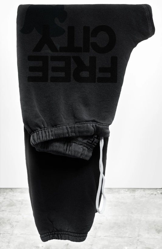 Unisex FLOW sweatpant in volcano with classic "FREECITY" print in black and black dark navy "FREECITYDOVE," covered elastic waist and pull drawcord.