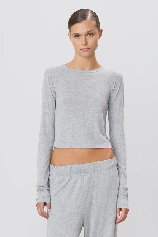 woman wearing grey long sleeve cropped tee shirt
