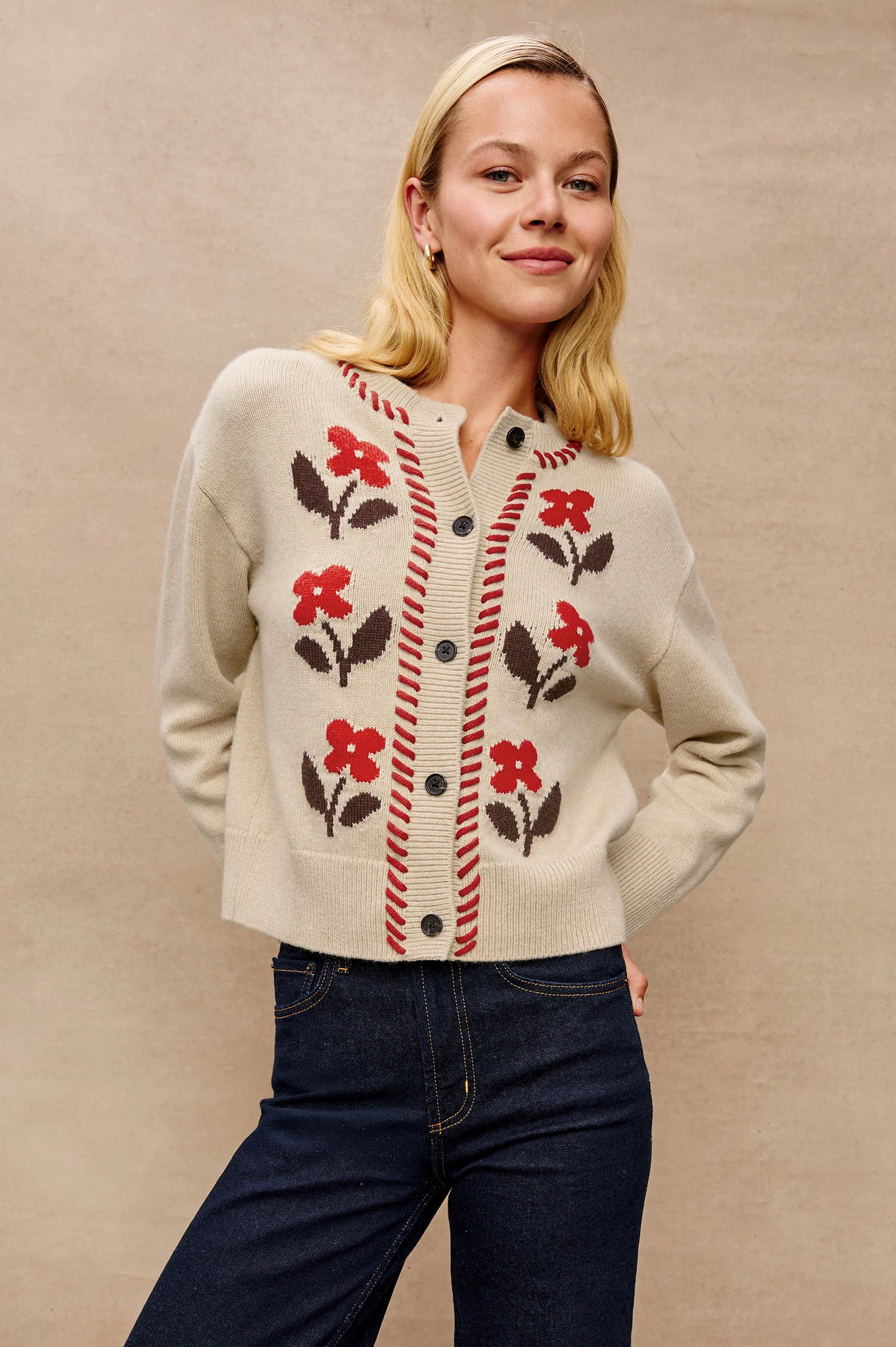 The Mavie is a heritage-inspired cardigan crafted from a cozy wool blend with a boxy-cropped fit. Blanket stitching and jacquard florals add a nostalgic touch.