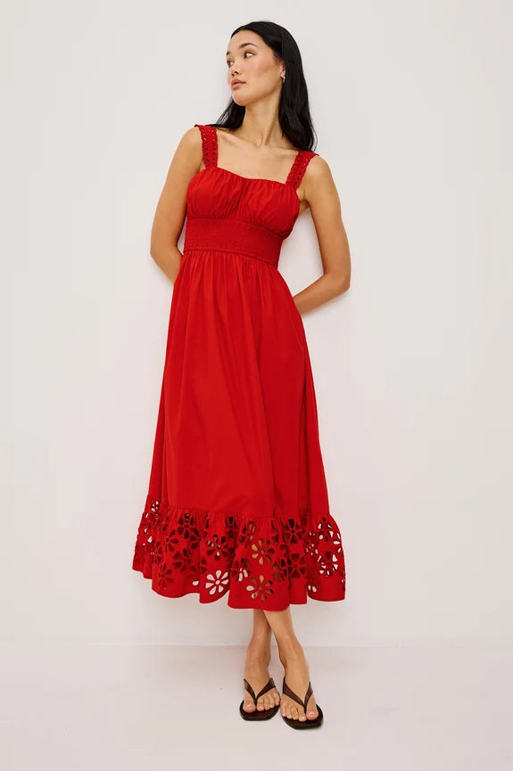 Woman wearing red eyelet sundress with sandals