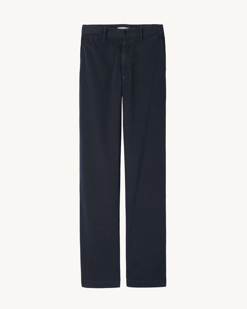 Flat front, mid-rise relaxed leg pant in brushed stretch twill cotton. Side slash pockets. Back welt pockets. Back darts. Coin pocket. Belt loops. Zip fly. Logo horn button closure.