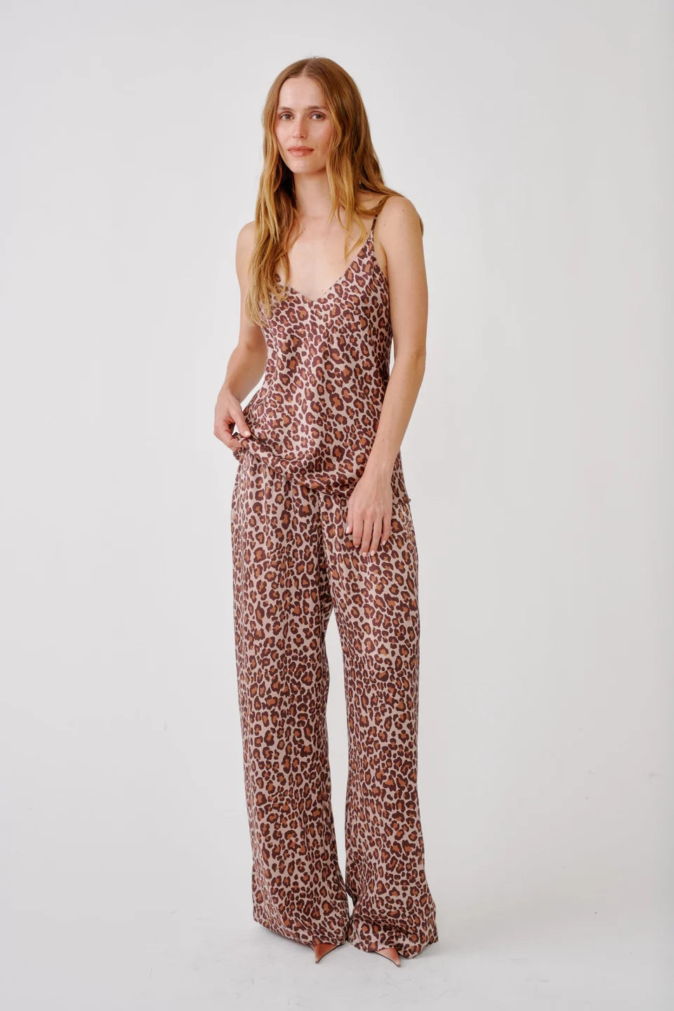 Woman wearing Leopard print silk pants from SABLYN