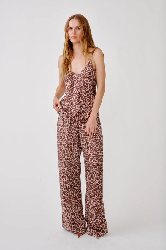 Woman wearing Leopard print silk pants from SABLYN