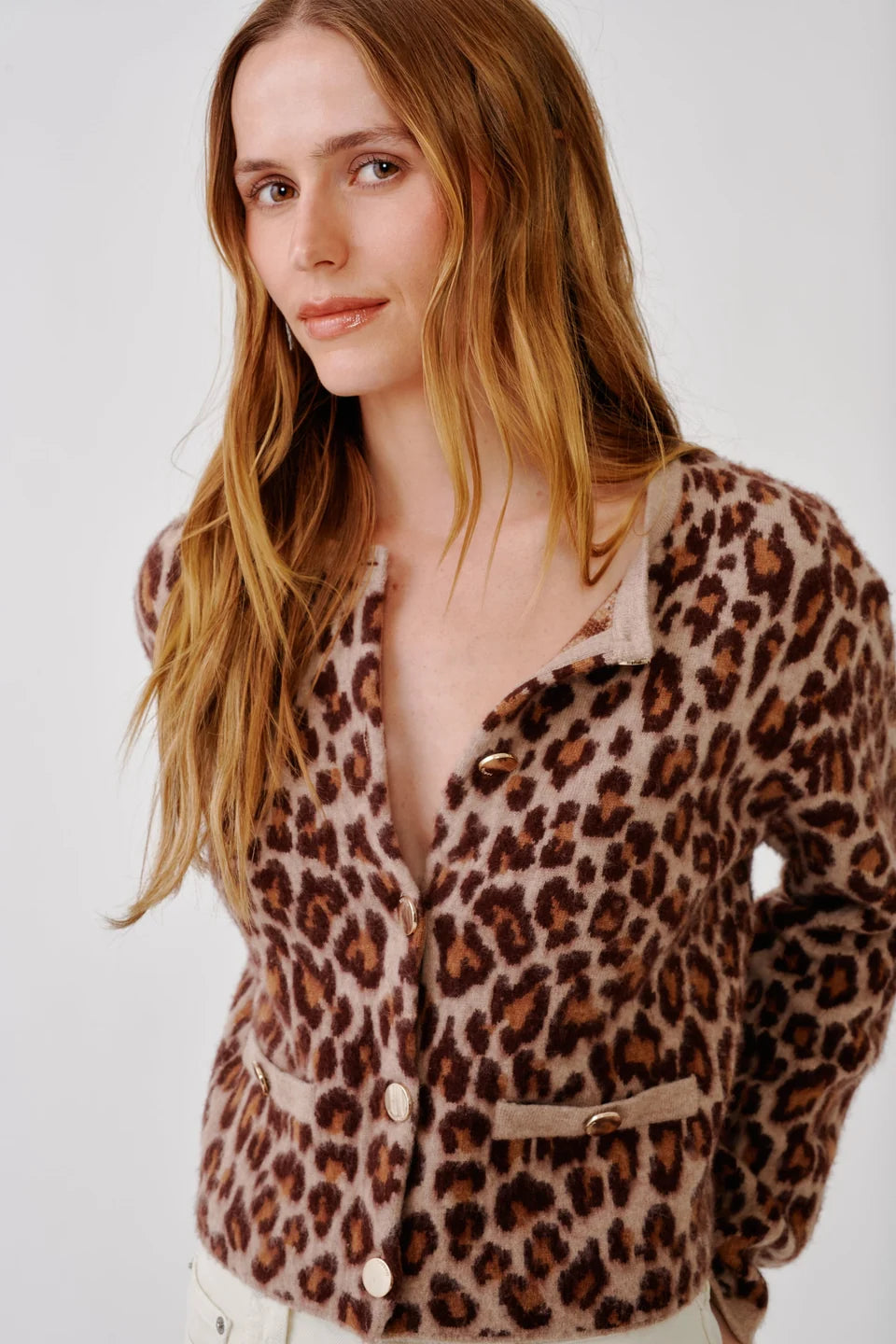 Woman wearing leopard cardigan jacket