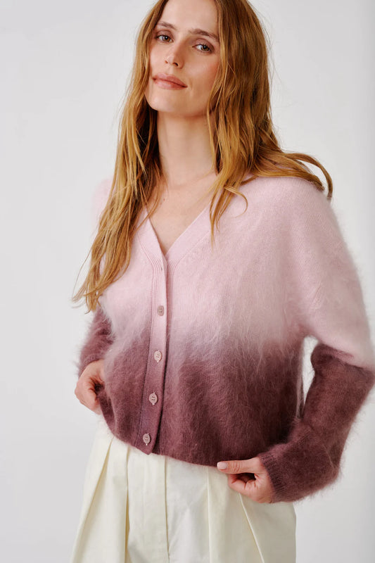 Woman wearing Sablyn's Jolie v-neck cardi in sof pink