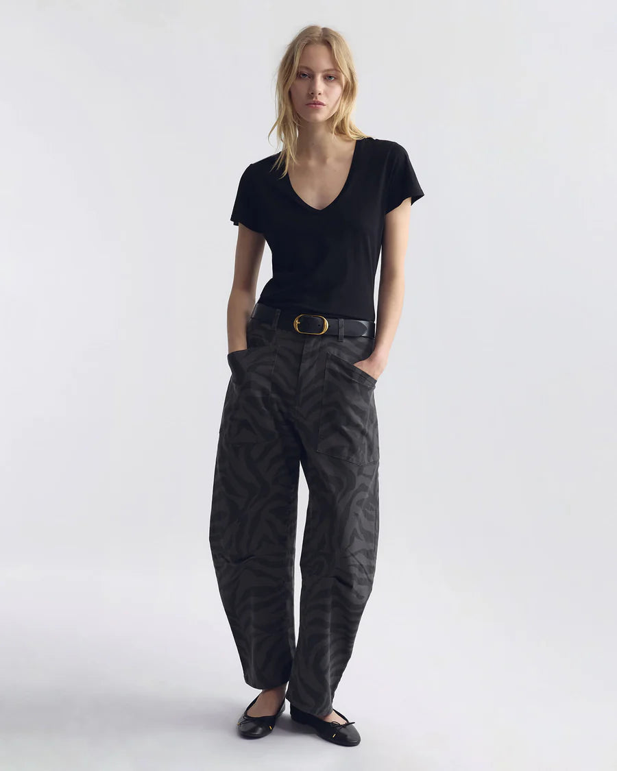 Woman wearing Nili Lotan Shon pant in Charcoal Zebra print