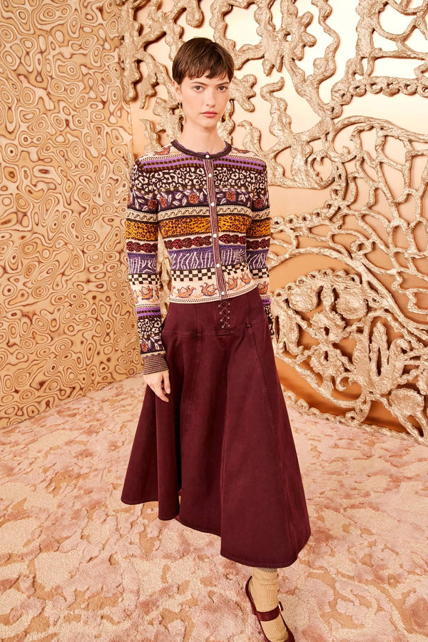 An eye-catching essential, the Liza Cardigan is spun from mid-weight jacquard with a stunning display of Fair Isle motifs in vibrant purple and gold hues. Made with hints of wool and alpaca, this long-sleeve, button-down fits close to the body and has metallic yarns that add a glimmering touch.