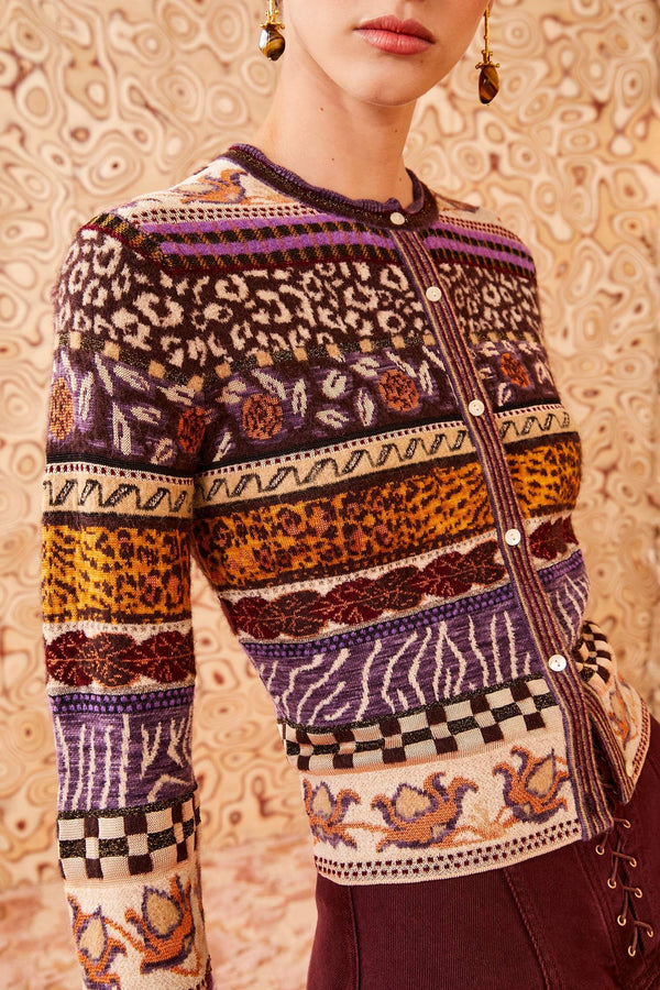 An eye-catching essential, the Liza Cardigan is spun from mid-weight jacquard with a stunning display of Fair Isle motifs in vibrant purple and gold hues. Made with hints of wool and alpaca, this long-sleeve, button-down fits close to the body and has metallic yarns that add a glimmering touch.