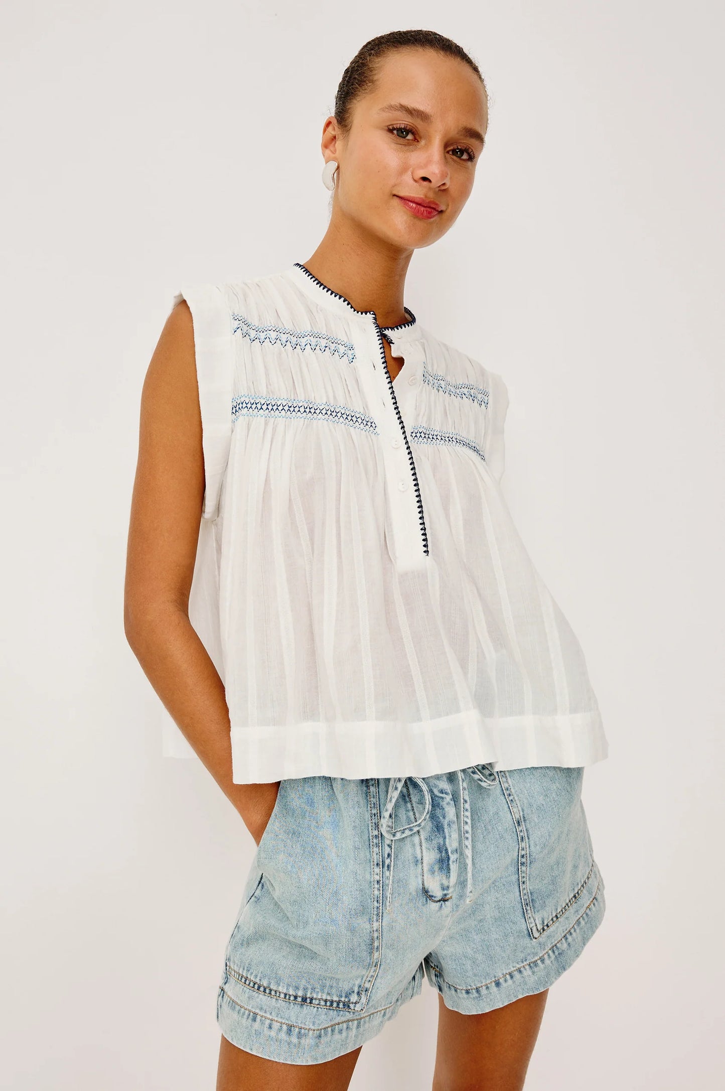 The Willow is a sleeveless trapeze-style top crafted from lightweight, subtly textured cotton. Effortless by design