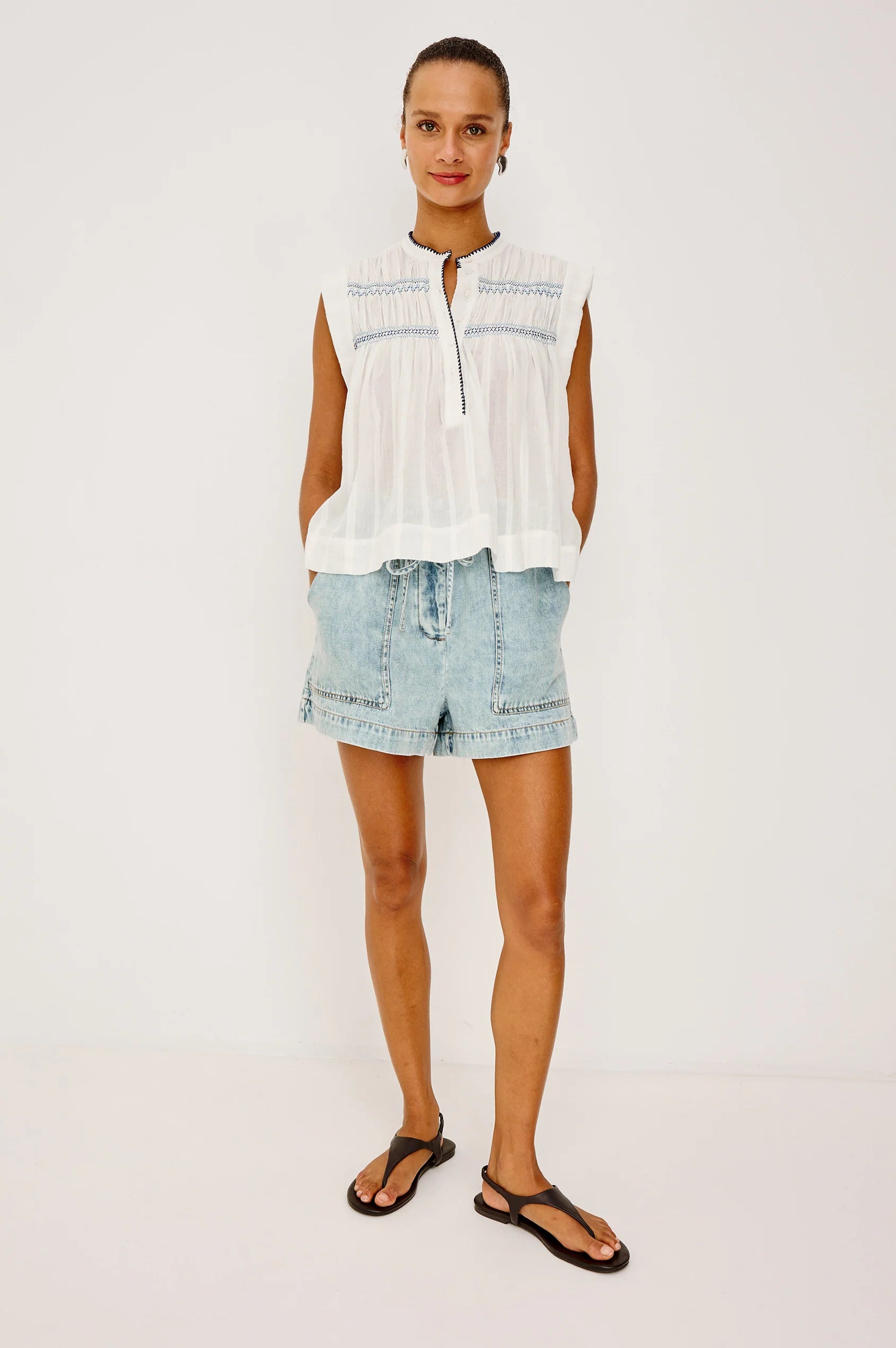 The Willow is a sleeveless trapeze-style top crafted from lightweight, subtly textured cotton. Effortless by design
