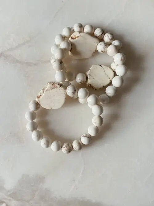 Meant to be stacked with 3 to 4 other bracelets from Emily Detert for the complete aesthetic.  Beads - cream howlite 10mm beads with unique rough cut cream howlite stone