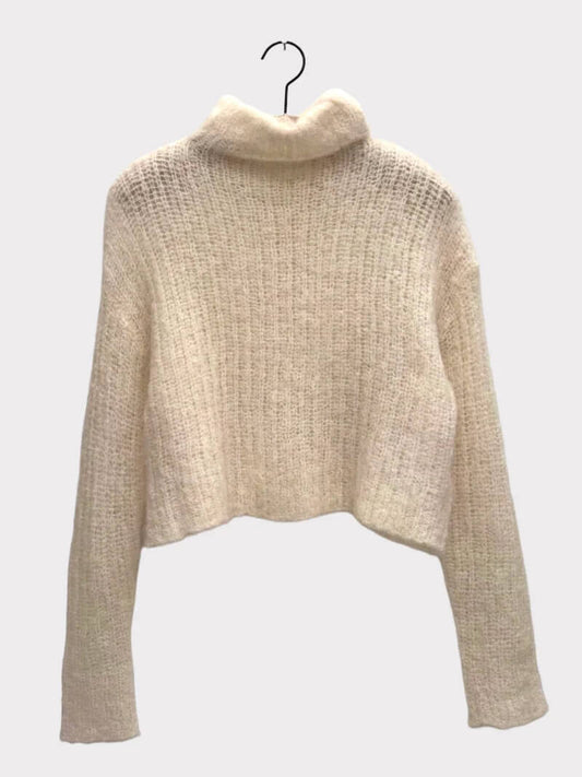 Elevate your cozy wardrobe with the Brazeau Tricot Topper Sweater in Buffalo. This open-knit, slightly cropped sweater is crafted from a luxurious blend of 78% alpaca, 19% nylon, and 3% spandex, offering softness and warmth with just the right amount of stretch. The rich buffalo hue and relaxed fit make it a chic layering piece for casual or polished looks.