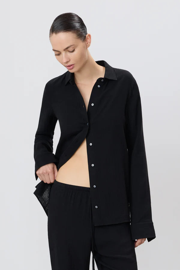 woman wearing black button down cotton gauzy shirt