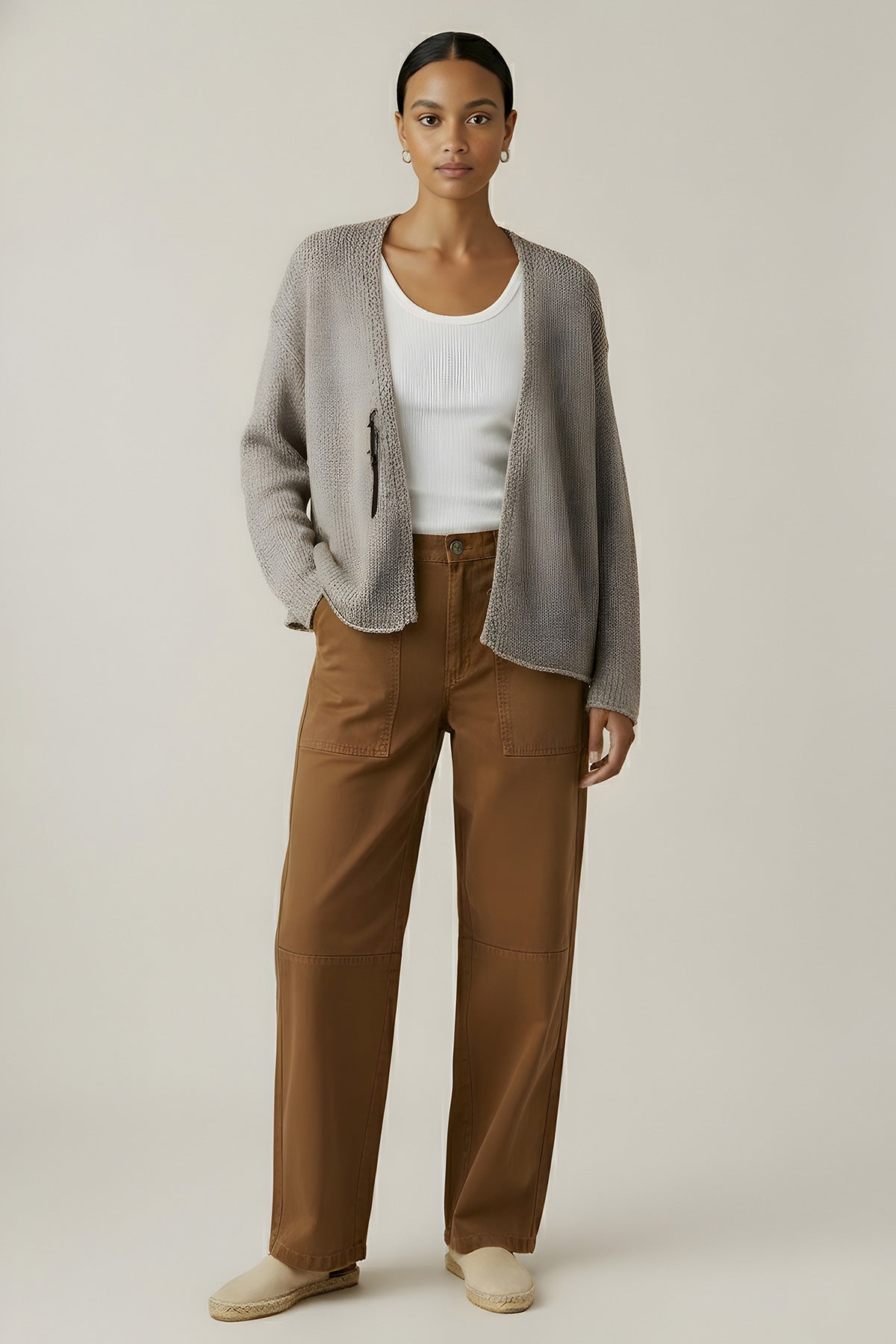 Light, relaxed, and effortlessly stylish, the Quinnly is an open-front cardigan crafted from cotton tape yarn with a long drop shoulder silhouette. 