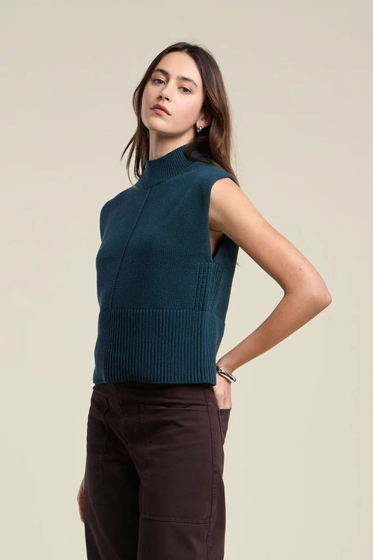 Combining enduring appeal with luxurious comfort, this mock neck sweater vest is crafted from a soft cotton cashmere blend. 