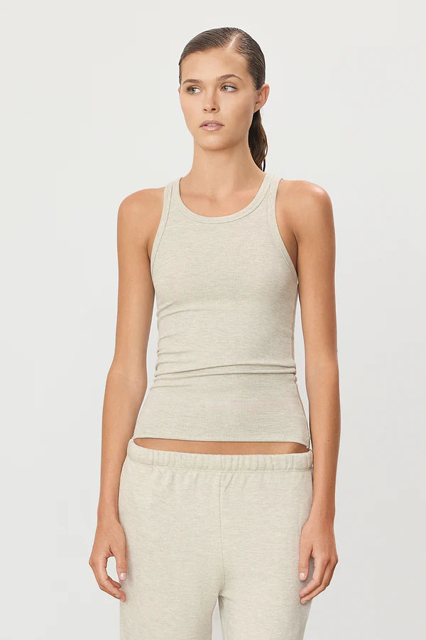 Woman wearing ribbed high neck fitted tank