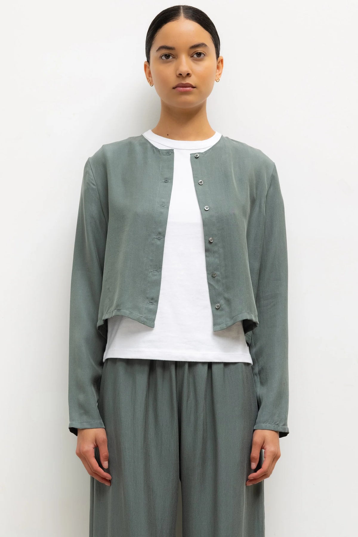 LESET Kim Classic Cardigan in Eucalyptus, a cropped Tencel blend button-front cardigan styled with matching Kim pants and a white tee.