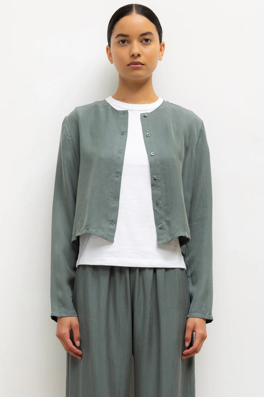LESET Kim Classic Cardigan in Eucalyptus, a cropped Tencel blend button-front cardigan styled with matching Kim pants and a white tee.