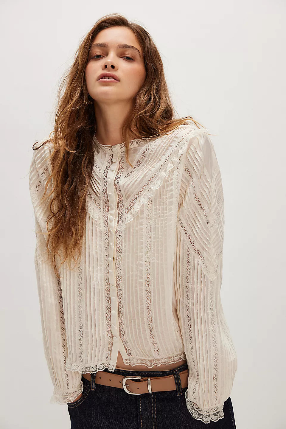 LoveShackFancy, featuring an airy fabrication, charming lace details, and a classic button-down silhouette for a timeless finish.