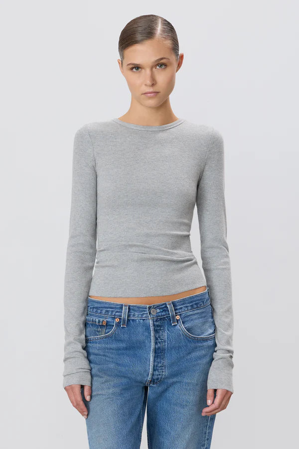 woman wearing grey long sleeve fitted shirt