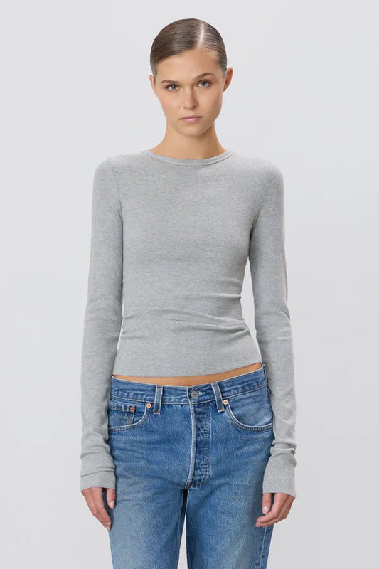 woman wearing grey long sleeve fitted shirt