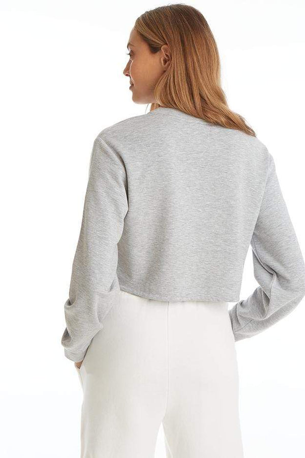 Back view of Juicy Couture Boxy Pullover in Powder Heather on model showing off cropped fit